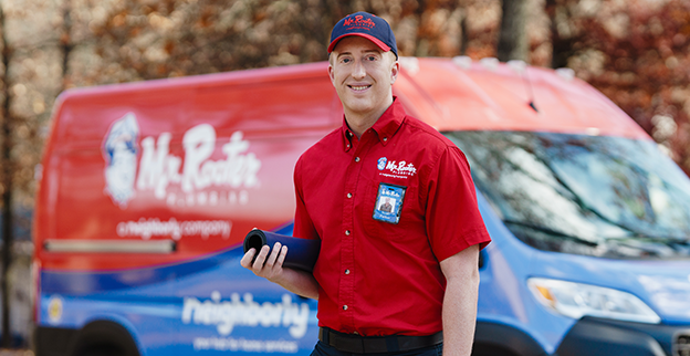 Mr. Rooter service professional walking up to a customer's home.