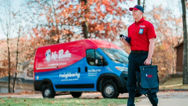 Mr. Rooter service professional walking up to a customer's home.